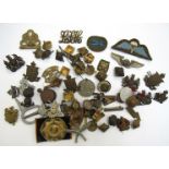 A collection of British military badges and insignia etc including Commando hat badge and Gurkhas