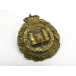 A Suffolk Regiment Puggaree badge in brass, two tower Gibraltar mark,