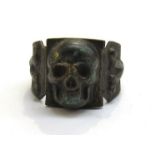 An SS style ring with skull and bones design