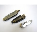 Three military pocket knives including Fielder & Son Southsea with horn grips and Encore T.
