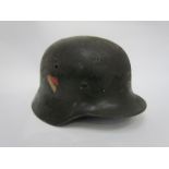 A Third Reich era German M40 helmet, later repainted,