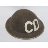 A WWII Brodie helmet with CD (Civil Defence) decal,