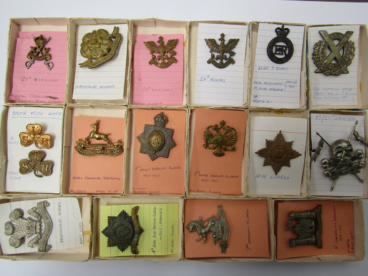 A collection of Hussars and Dragoons military cap badges including 14th King's Hussars and King