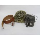 A post-war German M42 helmet with netting cover, together with brown leather belt stamped ST.