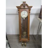 A 20th Century oak cased Vienna style wall clock, Roman enamelled dial signed Kienenger,