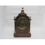 A Regency and later mahogany bracket clock of arched form with pagoda top,