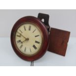 A Victorian postman's alarm clock striking a bell,