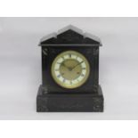 A Victorian slate mantel clock with 8 day striking Junghans movement,