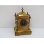 A Victorian brass cased mantel clcok with Arabic dial (glass and bezel missing),