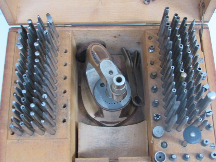 A cased watchmaker's staking set with a selection of punches - Image 2 of 2