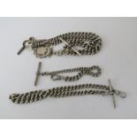 Three silver watch chains with T-bars and one Albert