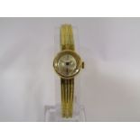 A Watches of Switzerland 18ct gold lady's bracelet watch