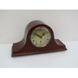 An early 20th Century mahogany Napoleon hat striking and chiming mantel clock, key and pendulum,