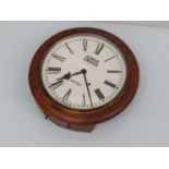An early 20th Century 12" mahogany dial clock signed Kings Cross, London,