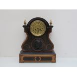 A 19th Century walnut and ebonised mantel clock with brass Roman dial,