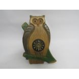 A 20th Century Paico novelty wooden owl wall clock with moving eyes, pendulum and weight,
