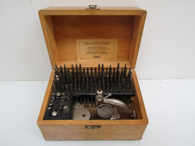 A cased "Favourite" watchmaker's staking set with a collection of punches