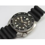 SEIKO: a 150m automatic diver's wristwatch in stainless steel case, day (English/Arabic) and date,