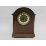 An Edwardian mahogany mantel clock with Japy Freres striking movement on a coiled gong,