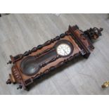 A 19th century mahogany Vienna style wall clock with Roman enamelled dial,