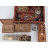 A quantity of mixed horology tools including keys, runners, winders,
