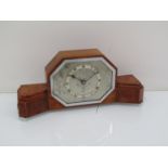 An Art Deco walnut cased timepiece with chrome bezel and feet, Elliott movement,