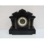 A 19th Century slate mantel clock of architectural form, French drum striking movement,