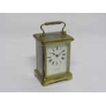 An early 20th Century French brass cased single train carriage timepiece with platform lever