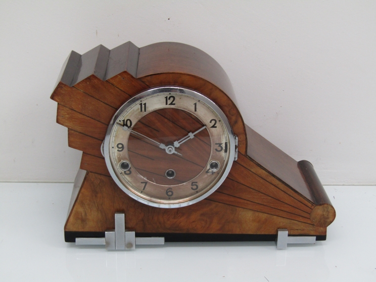 A 1930's walnut Art Deco striking and chiming mantel clock with silvered Arabic chapter ring,