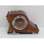 A 1930's walnut Art Deco striking and chiming mantel clock with silvered Arabic chapter ring,