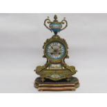 A 19th Century French Ormolu mantle clock with raised urn finial over Roman hand-painted dial,