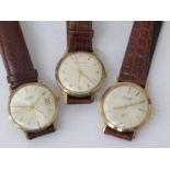 Three mid 20th Century 9ct gold cased gents wristwatches: Smith's Astral,