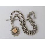 An Edwardian silver watch chain hung with Albert