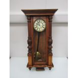 A 19th century walnut Vienna style wall clock with Roman enamelled dial,