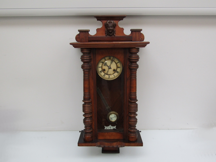 A late 19th/ early 20th Century Continental Vienna style wall clock with spring driven eight day