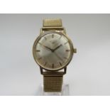 LONGINES: a 9ct gold cased gent's wristwatch, silvered dial with centre seconds,