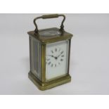 An early 20th Century brass cased carriage timepiece, Roman enamelled dial,