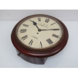 An early 20th Century mahogany cased 12" station dial clock with painted metal Roman dial signed