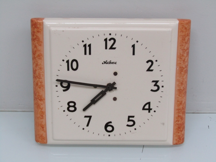 An Art Deco ceramic wall clock,