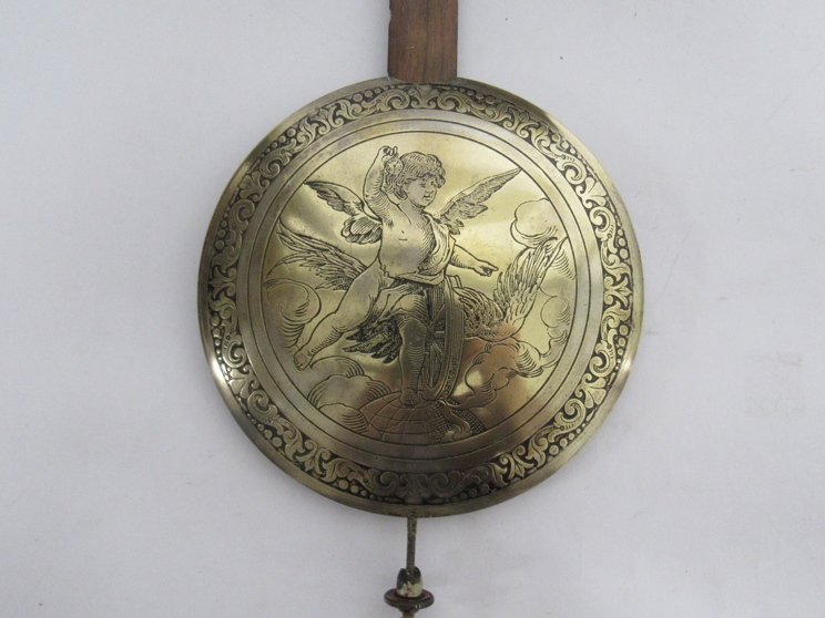 A spring driven striking wall clock with engraved silvered arched dial and pendulum bob, - Image 2 of 3