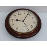 A mid 20th Century 12" dial clock with spring driven 30 hour movement,