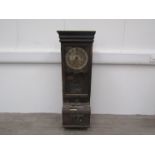 An early 20th Century International Time Recorder clocking on clock, with key and pendulum,