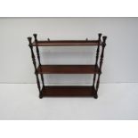 A set of 19th Century mahogany three-tier wall shelves with turned uprights,