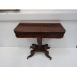 A Regency rosewood crossbanded card table, on quatreform pedestal base,