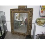 A large 19th Century bevel edged mirror,