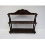 A set of early 19th Century heavy Cuban mahogany graduated three-tier wall shelves with