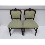 A set of six Victorian rosewood chairs, carved back, green upholstery,