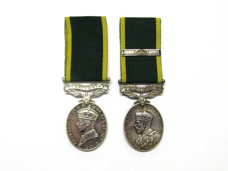 Two Efficiency Medals with Territorial bars: George V named to 724426 W.O. CL.II. A.E. HOWARD. R.A.