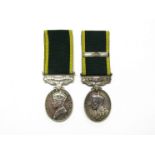 Two Efficiency Medals with Territorial bars: George V named to 724426 W.O. CL.II. A.E. HOWARD. R.A.