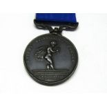 A Royal Humane Society bronze medal awarded to ERNEST SMETHURST on 15th February 1902.